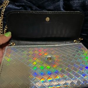 Rainbow holographic looking clutch wallet with chain is stylish and matches all